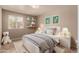 Bright bedroom featuring a white bed frame, neutral walls, and playful decor, creating a calming space at 926 W Grand Caymen Dr, Gilbert, AZ 85233