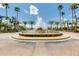 Community water fountain surrounded by cobblestone and palm trees at 926 W Grand Caymen Dr, Gilbert, AZ 85233