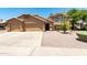 Charming two-story home featuring a three-car garage and well-maintained desert landscaping at 926 W Grand Caymen Dr, Gilbert, AZ 85233