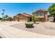 Charming two-story home with a three-car garage, desert landscaping, and a tiled roof at 926 W Grand Caymen Dr, Gilbert, AZ 85233