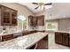Spacious kitchen featuring granite countertops, stainless steel appliances, and vaulted ceilings at 926 W Grand Caymen Dr, Gilbert, AZ 85233