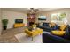 Inviting living room featuring a fireplace, comfortable seating, and a view of the backyard at 926 W Grand Caymen Dr, Gilbert, AZ 85233