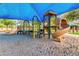 Community playground featuring multiple slides, climbing structures, and a shaded area at 926 W Grand Caymen Dr, Gilbert, AZ 85233
