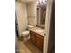 Bathroom with wood cabinets, granite countertop and neutral tile flooring at 10080 E Mountainview Lake Dr # 110, Scottsdale, AZ 85258