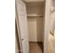 Bedroom closet with a door and bar for hanging clothes at 10080 E Mountainview Lake Dr # 110, Scottsdale, AZ 85258