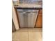Stainless steel dishwasher nestled between granite countertop and wooden cabinets at 10080 E Mountainview Lake Dr # 110, Scottsdale, AZ 85258