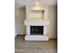 Living room showing white fireplace with mantle and tile flooring at 10080 E Mountainview Lake Dr # 110, Scottsdale, AZ 85258