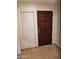 A wood paneled front door with a window featuring blinds at 10080 E Mountainview Lake Dr # 110, Scottsdale, AZ 85258
