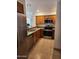 Kitchen with stainless steel appliances, granite countertops, and tile flooring creating a modern space at 10080 E Mountainview Lake Dr # 110, Scottsdale, AZ 85258