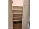 Hall pantry with shelves and white door at 10080 E Mountainview Lake Dr # 110, Scottsdale, AZ 85258