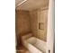 Tiled shower and bath with built in bench and cubby at 10080 E Mountainview Lake Dr # 110, Scottsdale, AZ 85258