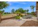 Pool, golf course, palm trees, and other plants make for a lush backyard at 1079 S Western Skies Dr, Gilbert, AZ 85296