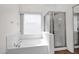 Bathroom highlighting a soaking tub and glass-enclosed shower at 1079 S Western Skies Dr, Gilbert, AZ 85296