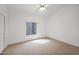 Bright bedroom features neutral carpet, ceiling fan, and lots of natural light at 1079 S Western Skies Dr, Gilbert, AZ 85296