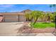 Inviting home featuring a tile roof, a 3 car garage, and desert landscaping at 1079 S Western Skies Dr, Gilbert, AZ 85296