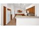 Bright kitchen with custom cabinets, tile floors, and a center island at 1079 S Western Skies Dr, Gilbert, AZ 85296