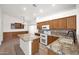 Bright kitchen features granite countertops, center island, and modern appliances at 1079 S Western Skies Dr, Gilbert, AZ 85296