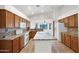 Open kitchen with granite countertops, island, and views of the living room at 1079 S Western Skies Dr, Gilbert, AZ 85296