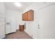 Functional laundry room with sink, storage, and access to the garage at 1079 S Western Skies Dr, Gilbert, AZ 85296