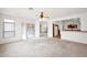 Bright living room featuring carpet, neutral paint, and backyard access at 1079 S Western Skies Dr, Gilbert, AZ 85296