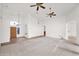 Open living room with carpet, neutral paint, ceiling fans, and natural light at 1079 S Western Skies Dr, Gilbert, AZ 85296