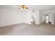Spacious main bedroom with neutral carpet and en-suite bathroom access at 1079 S Western Skies Dr, Gilbert, AZ 85296