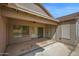 Covered patio features a ceiling fan and sliding glass doors to the interior at 1079 S Western Skies Dr, Gilbert, AZ 85296