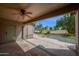 Covered patio looks out onto the pool and golf course at 1079 S Western Skies Dr, Gilbert, AZ 85296