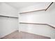 Walk-in closet with ample shelving and hanging space at 1079 S Western Skies Dr, Gilbert, AZ 85296