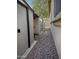 A view of the backyard with outdoor storage sheds and crushed rock landscaping at 10909 E Sentiero Ave, Mesa, AZ 85212
