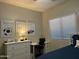 Bedroom includes a dresser, desk and bed at 10909 E Sentiero Ave, Mesa, AZ 85212