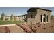 Community entrance to Bella Via is brick with rose bushes at 10909 E Sentiero Ave, Mesa, AZ 85212