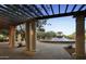 Beautiful community fountain viewed from under a trellis at 10909 E Sentiero Ave, Mesa, AZ 85212
