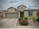 Charming single-story home features a low maintenance desert landscape and two-car garage at 10909 E Sentiero Ave, Mesa, AZ 85212