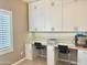 Office features built-in cabinets, work space and 3D printer at 10909 E Sentiero Ave, Mesa, AZ 85212