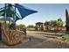 Community playground featuring slides, climbing structures, and shade for safe outdoor fun at 10909 E Sentiero Ave, Mesa, AZ 85212