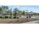 Community playground with mature trees providing shade at 10909 E Sentiero Ave, Mesa, AZ 85212