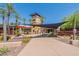 Community center showcasing a tower surrounded by shade structures, and palm trees at 12035 W Roy Rogers Rd, Peoria, AZ 85383