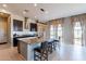 Bright kitchen featuring a large island, stainless steel appliances, modern lighting, and plenty of cabinet space at 12035 W Roy Rogers Rd, Peoria, AZ 85383