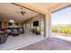 Open living space featuring a comfortable sectional sofa, large sliding doors, and seamless indoor-outdoor living at 12035 W Roy Rogers Rd, Peoria, AZ 85383