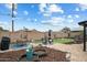 Spacious backyard featuring a lush green lawn, mature trees, and patio at 1504 W 6Th St, Mesa, AZ 85201