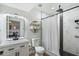 Beautiful bathroom featuring a black and white design with modern fixtures and lighting at 1504 W 6Th St, Mesa, AZ 85201