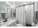 Beautiful bathroom featuring modern fixtures, a shower, and a decorative mirror at 1504 W 6Th St, Mesa, AZ 85201