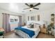Comfortable bedroom featuring carpet, a ceiling fan, and neutral tones at 1504 W 6Th St, Mesa, AZ 85201