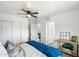 Bright bedroom featuring a ceiling fan, fresh paint, and sliding closet doors at 1504 W 6Th St, Mesa, AZ 85201