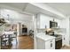 Open kitchen featuring white cabinets, stainless steel appliances, and eat-in dining at 1504 W 6Th St, Mesa, AZ 85201