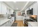 Modern kitchen with sleek appliances, white cabinets, and ample counter space at 1504 W 6Th St, Mesa, AZ 85201
