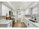 Modern kitchen featuring white cabinets, stainless steel appliances, and stylish backsplash at 1504 W 6Th St, Mesa, AZ 85201