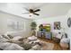 Comfortable living room showcasing light-colored walls, a ceiling fan, and natural light at 1504 W 6Th St, Mesa, AZ 85201