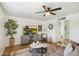 Cozy living room featuring wood floors, a ceiling fan and TV set on console at 1504 W 6Th St, Mesa, AZ 85201